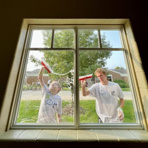 volunteer group cleans windows