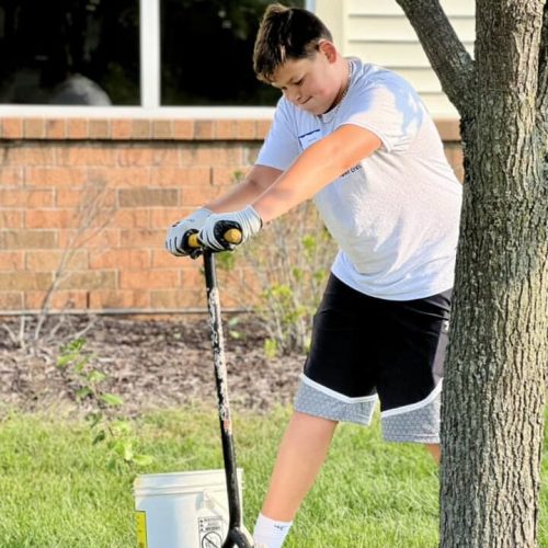 volunteer teen cleaning up campus